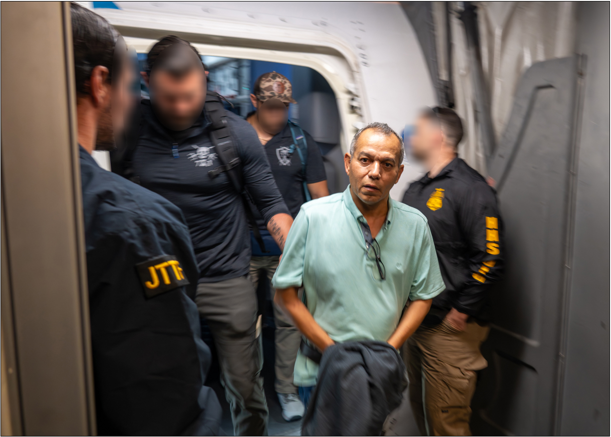 Khalid Satary arrest — escorted by federal agents